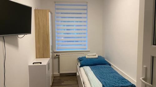 Ένα ή περισσότερα κρεβάτια σε δωμάτιο στο DC Room Johannes