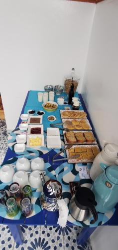 a blue table topped with different types of food at Riad Al Manara in Essaouira