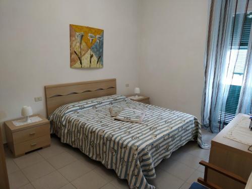 Ένα ή περισσότερα κρεβάτια σε δωμάτιο στο casa patrizia