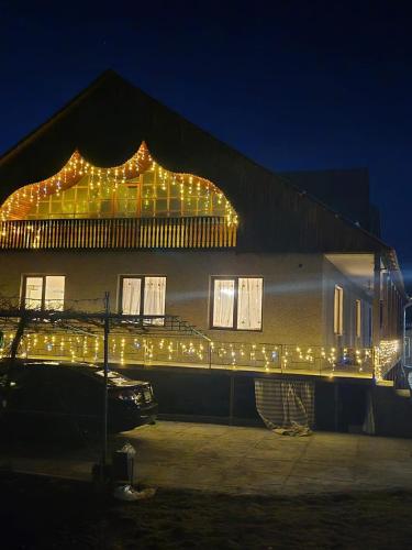 a building with christmas lights on the side of it at BIG HOUSE in Dilijan