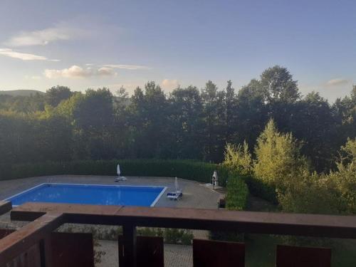 a view of a swimming pool from a balcony at Splendido Chalet in Camigliatello Silano