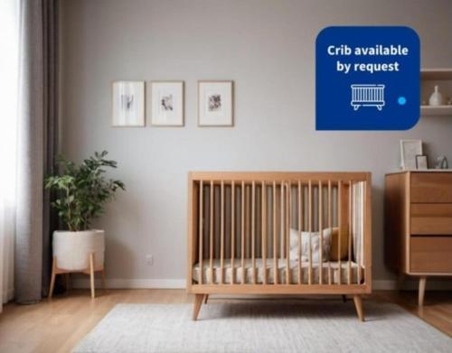 a crib in a room with a cat sitting on it at Melipal Schuss ARG41 in San Carlos de Bariloche