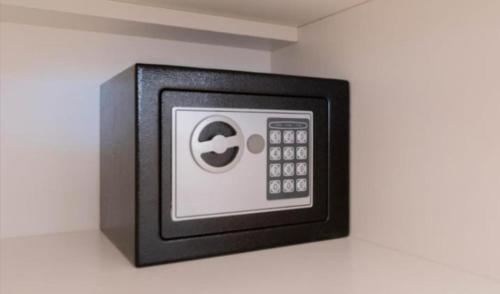 a black and white microwave with an apple symbol on it at Melipal Schuss ARG41 in San Carlos de Bariloche