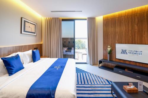 Postel nebo postele na pokoji v ubytování Modrest Hotel