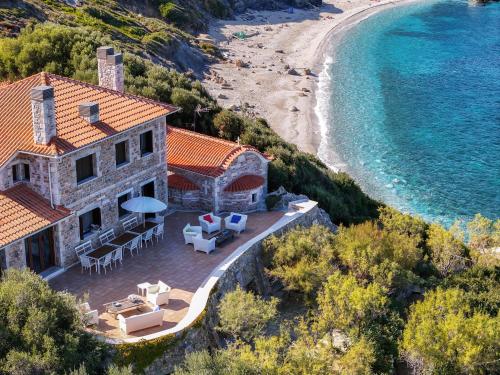an aerial view of a house and the beach at St George's House in Potistika