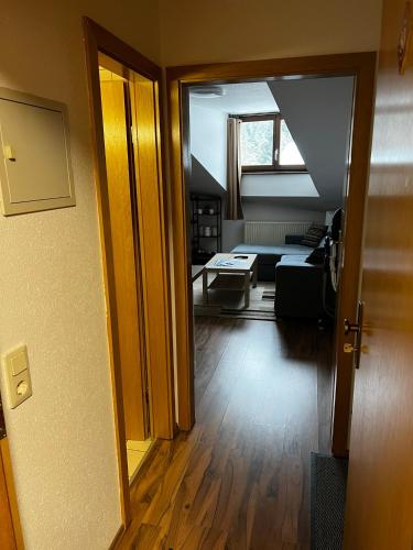 an open door to a room with a living room at Family Apartment Šumava in Bayerisch Eisenstein