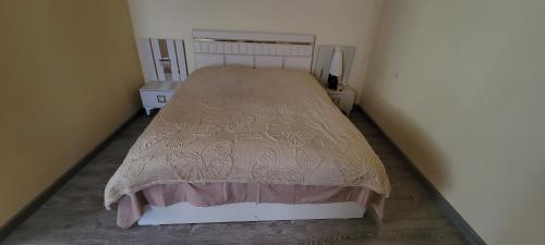 a small bedroom with a bed in a room at Hotel Maria in Mestia