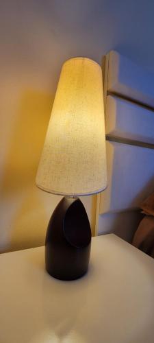 a lamp sitting on top of a table at Hotel Maria in Mestia