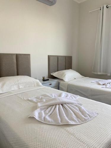 Ein Bett oder Betten in einem Zimmer der Unterkunft Condomínio Boas vistas