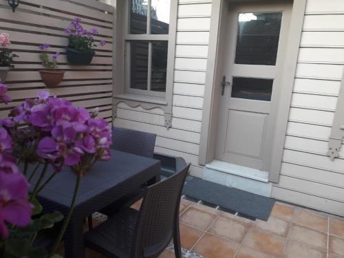 a patio with a table and chairs and a door at Valide i Suit in Istanbul