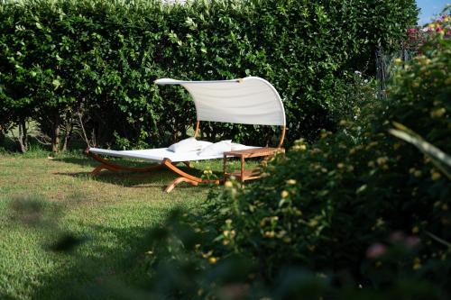 a chair sitting in the grass in a yard at Mammacaterina - Procida in Procida