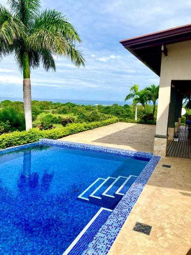 a swimming pool with a view of the ocean at Villas with breathtaking seaview in Marbella