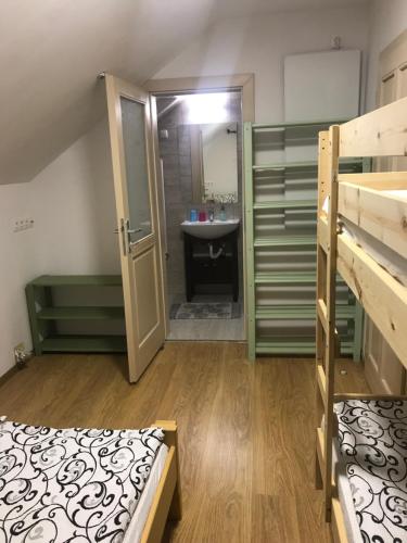 a room with two bunk beds and a sink at Skh 2 in Praid