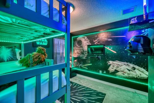 a room with a star wars mural on the wall at Kid-Approved Stay Pool, Parks & Themed Rooms! in Kissimmee