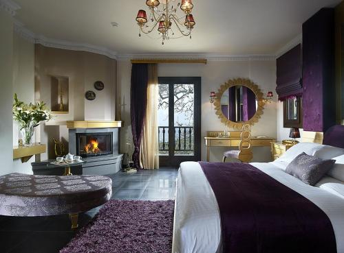 Ein Bett oder Betten in einem Zimmer der Unterkunft Stevalia Hotel & Spa