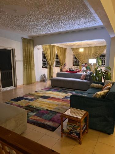 a living room with couches and a rug at 428 Boutique Guesthouse in Boscobel