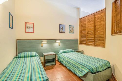 Postel nebo postele na pokoji v ubytování Casale Le Pitte