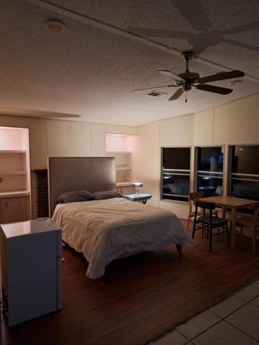 a bedroom with a bed and a table and chairs at 1233 Apartment 3 Miami in Tamiami