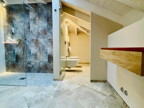 a bathroom with a shower and a sink and a toilet at Pietralunga Resort in Fidenza