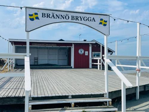 a sign for a bannino tavernaza on a dock at 4 star holiday home in BRäNNö in Brännö