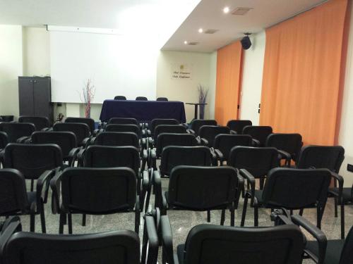 a room with rows of chairs in a room at Hotel Ristorante Dragonara in San Giovanni Teatino