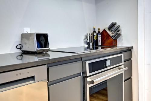 a kitchen with a counter with a toaster on it at Modern Luxury 4-Bedroom Home by Mont-Tremblant Ski Resort in Lac-Superieur
