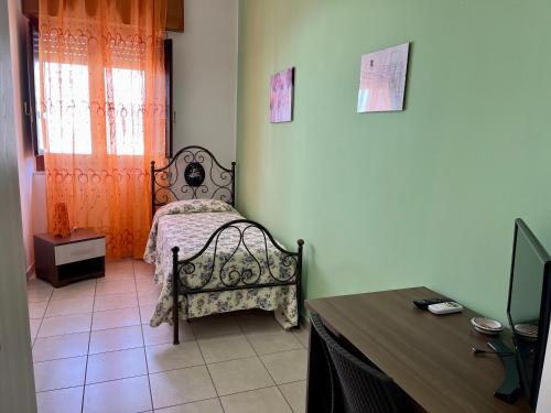 A bed or beds in a room at Costa Gaia Rooms