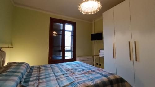 a bedroom with a bed and a window at Le rondini di San Donato in Lucca