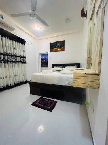 a bedroom with a large bed in a room at Nisha Grean Heaven in Weligama