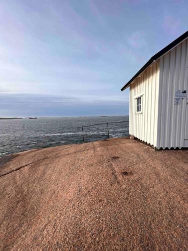 a building on the shore of the ocean at Skalhamn a village seaside in Lysekil