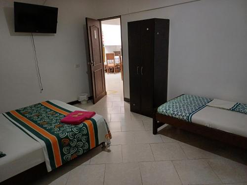 Postel nebo postele na pokoji v ubytování Casablanca Hostel Cali B&B