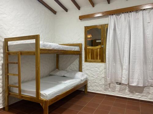 Postel nebo postele na pokoji v ubytování Cabaña con piscina para disfrute social y familiar