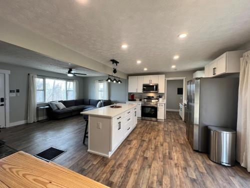 an open kitchen and living room of a house at MidWay Mountain Views in Asheville