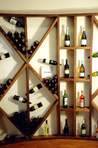 a wine cellar filled with lots of bottles of wine at Kena Beach Hotel in Matemwe