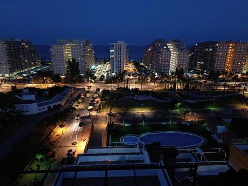 a view of a city at night with at Torremar - Magic World - Marina d'or in El Borseral