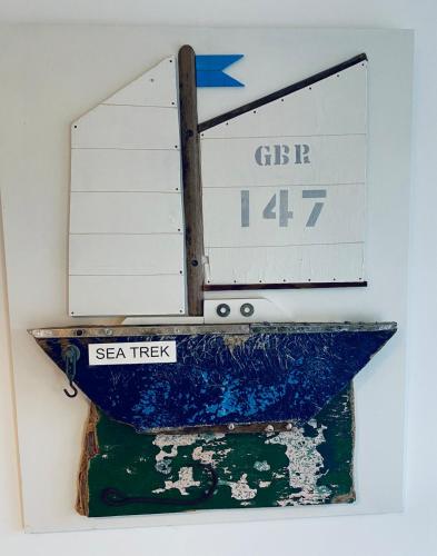 a sign on a wall with a sign on it at NEW Cosy Gem, Near Beach, Log-Burner, Dog Friendly in East Wittering
