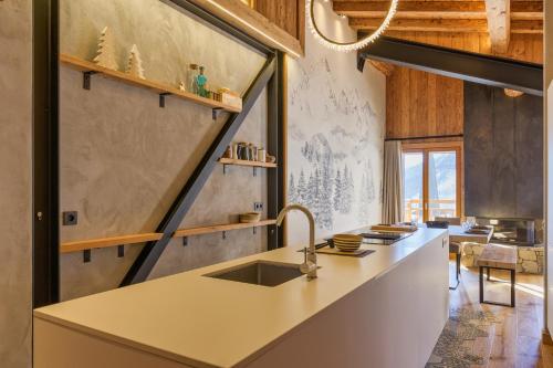a kitchen with a sink and a counter top at La Ferme à Roland ski in - ski out - Happy Rentals in Chamonix-Mont-Blanc