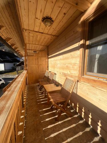 a row of chairs sitting in the back of a sauna at Apartmaji Katrnjek in Bohinj