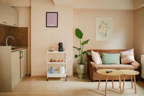 a living room with a couch and a table at Central Studio Apartments by Parkside Boutique in Skopje