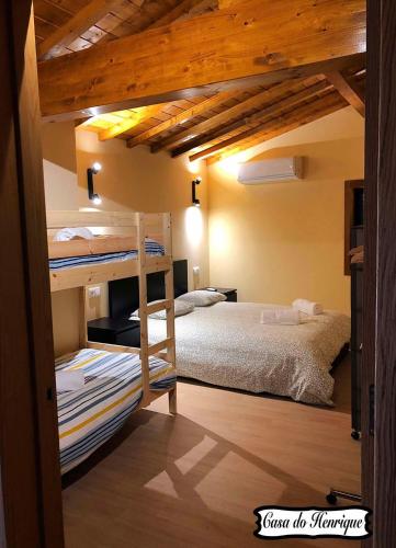 a bedroom with a bunk bed in a room at Casa do Henrique in Bragança