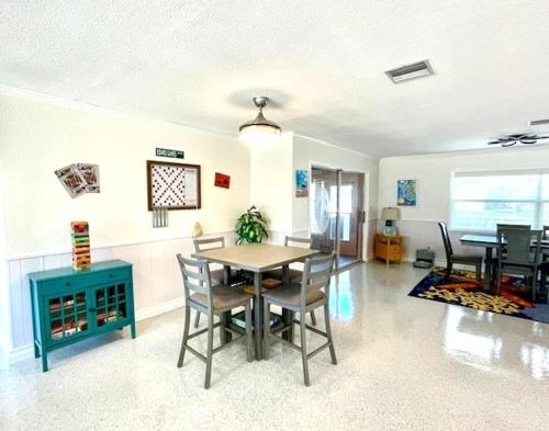 a dining room with a table and chairs at Hot tub and Dock Gilligan's on the Island in Matlacha