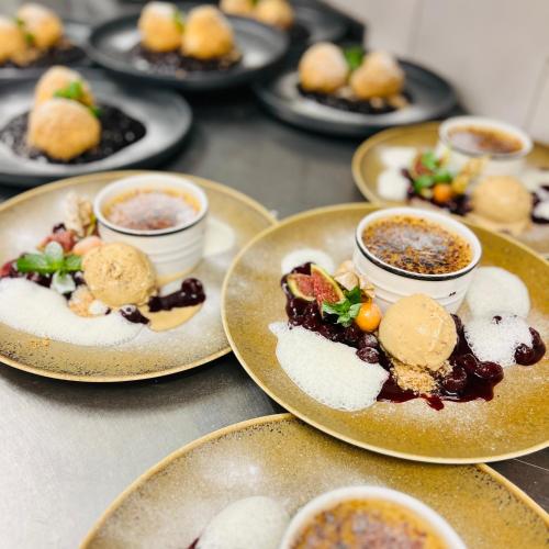a group of plates of food on a table at Thalberghof by Taschler in Knittelfeld
