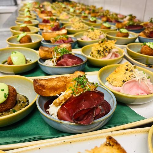 a table filled with bowls of different types of food at Thalberghof by Taschler in Knittelfeld