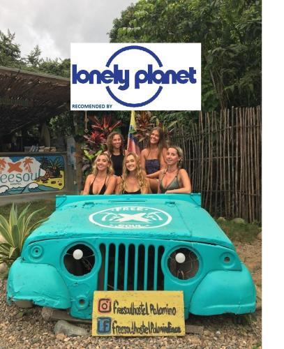 a group of women standing on a largelatablelatable jeep at Freesoul Hostel in Palomino
