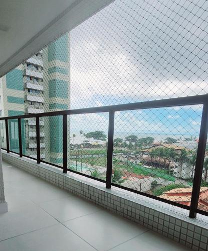 a view from a window in a building at Praia dos Milionários - Ilhéus - Apartamento Duna 403 com 2 quartos - Completo - Vista mar - Conforto in Ilhéus