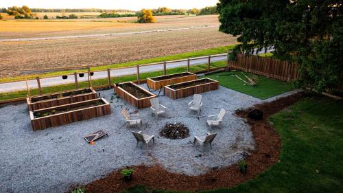 an aerial view of a patio with chairs and a fire pit at The White House in Caledonia