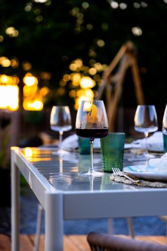a table with glasses of wine sitting on it at The White House in Caledonia