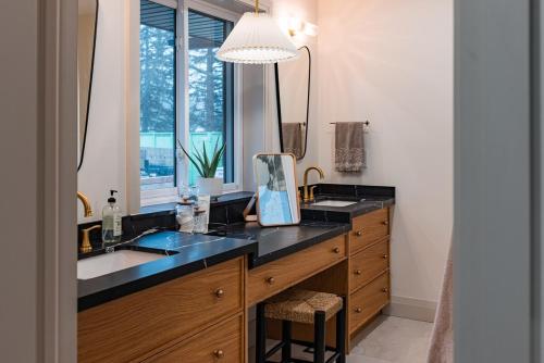 a bathroom with a sink and a mirror at The White House in Caledonia