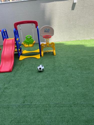 a play area with a soccer ball and a playground at Praia dos Milionários - Ilhéus - Apartamento Duna 403 com 2 quartos - Completo - Vista mar - Conforto in Ilhéus