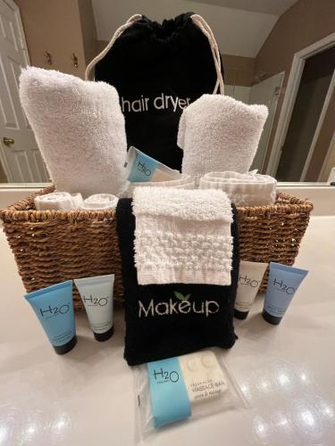 a group of towels and other products on a counter at Elegant and Spacious Retreat in Tomball